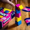 Wonky: The Unstable Party Game, An Abstract Strategy and Dexterity Wooden Block Stacking Game for All Ages, Tower Balancing Game, 9 Colorful Wooden Cubes,1+ Players, Ages 8 & Up, 20+ minute Play Time