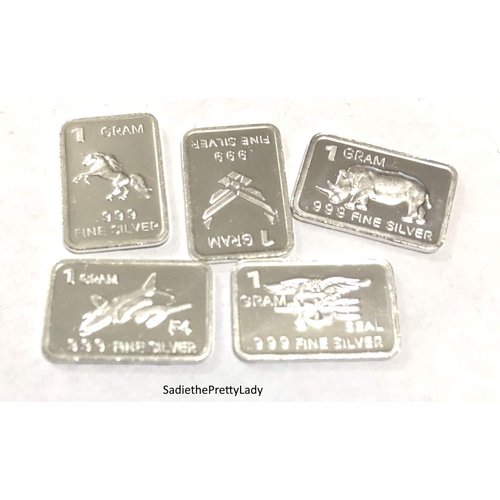 Five One Gram .999 pure Silver Bars with random designs in a jewelry pouch by Jewlmen