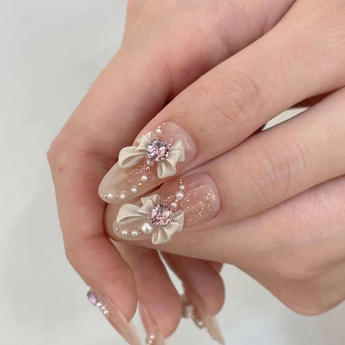 Rilafuvu Press on Nails,French Almond Press on Nail Nude Medium Long False Nails Cute/lovely Fake Nails 3D Bow Acrylic Nails Rhinestones Glue on Nails 24Pcs-12Sizes
