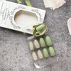 Almond Press on Nails Short Green Fake Nails Acrylic Glossy False Nails with Designs Artificial Full Cover Glue on Nails Stick on Nails for Women Girls Nail Decorations 24Pcs