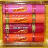 Lip Smackers (1) 4pc Lip Balm Tin Set Starburst Flavors - Strawberry, Cherry Kiwi, Mango Melon, Orange - Holiday Edition - Yellow Tin with Starburst Candy Design - Net Wt. 0.56 oz