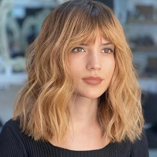 SEVENCOLORS Short Blonde Wavy Wigs for Women Medium Length Curly Bob Wigs with Bangs Halloween Cosplay Costume Synthetic Strawberry Blond Wig