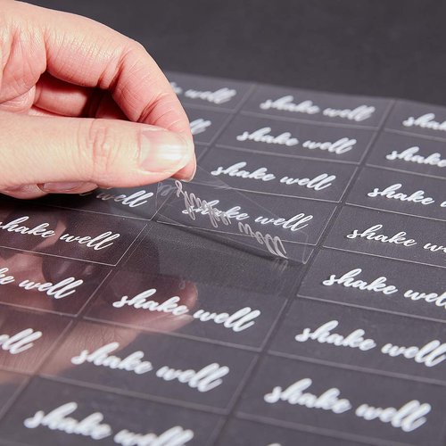 Restaurantware Label Tek 1.9 x 1 Inch Shake Well Juice Bottle Labels 100 Water-Resistant Labels For Bottles - Self-Adhesive Clear With White Font Plastic Bottle Stickers For Drink Pouches