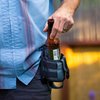 Nite Ize Traveler Drink Holster - Traveler & Water Bottle Holder for Hands-Free Use - Drink Pouch Holster for Waistbands & Belts - Adjustable Beverage Holder with Rotating Clip - Black