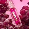Lottie London Roller Glaze in Feeling Grape, color changing nourishing lip oil which adapts to the natural pH in your lips
