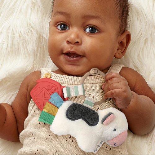 Itzy Ritzy Infant Toy & Teether - Itzy Pal Baby Teething Toy Includes Lovey, Crinkle Sound, Textured Ribbons & Silicone Teether Toy for Newborn (Cow)