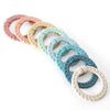 Itzy Ritzy Linking Ring Set; Set of 8 Braided, Rainbow-Colored Versatile Linking Rings; Attach to Baby's Car Seat, Stroller & Activity Gym to Keep Toys Nearby; Rainbow