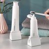 2pcs Rolling Tube Toothpaste Squeezer Toothpaste Seat Holder Stand for Bathroom Accessories（Milky）