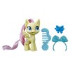 My Little Pony Fluttershy Potion Pony Figure - 3-Inch Yellow Pony Toy with Brushable Hair, Comb, and 4 Surprise Accessories