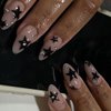 Maigitur Black Star Press on Nails Medium Almond Fake Nails with Design Rhinestone Stick on Nails Acrylic Nails Star False Nails Glossy Natural Nude Glue on Nails for Women Girls Manicure 24Pcs