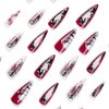 IMSOHOT Stiletto Press on Nails Long Gothic Fake Nails Black Red Ombre Glossy False Nails with Metal Cross Charms Designs Full Cover Glue on Nails 24PCS Acrylic Reusable Almond Nails