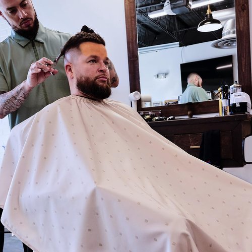 Barber Strong The Barber Cape Haircut Cover for Men, Hair Repelling and Static-Reducing Material, Flexible Elastic Neckband, Water Resistant Fabric, Oversized for Complete Coverage - Khaki Shield