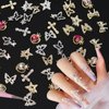 66Pcs Silver Gold Butterfly Heart Bow Nail Gems Charms Kit 3D Cross Star Nail Art Jewelry Alloy Rhinestones Gems Charms for Nail Art DIY Jewel Accessories