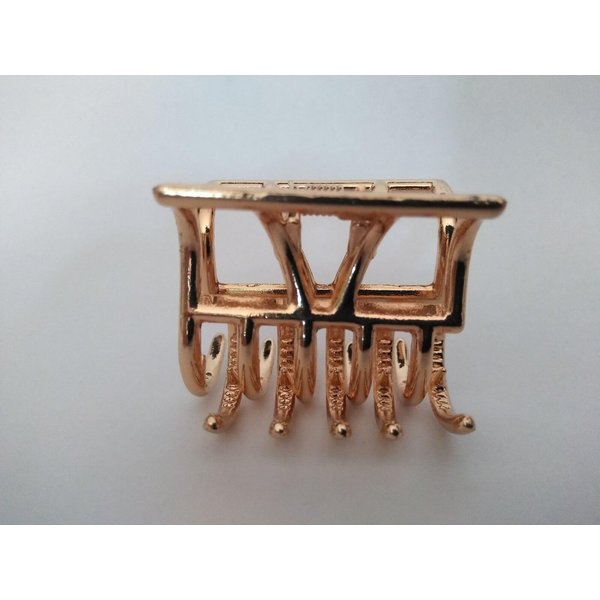 Small gold tone geometric metal hair claw clip