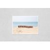 Poster Reproduction of Vacation word on wood rubber stamps stack on the sand beach for holiday and summer season concepts, beautiful blue ocean view during daytime on a sunny day on background