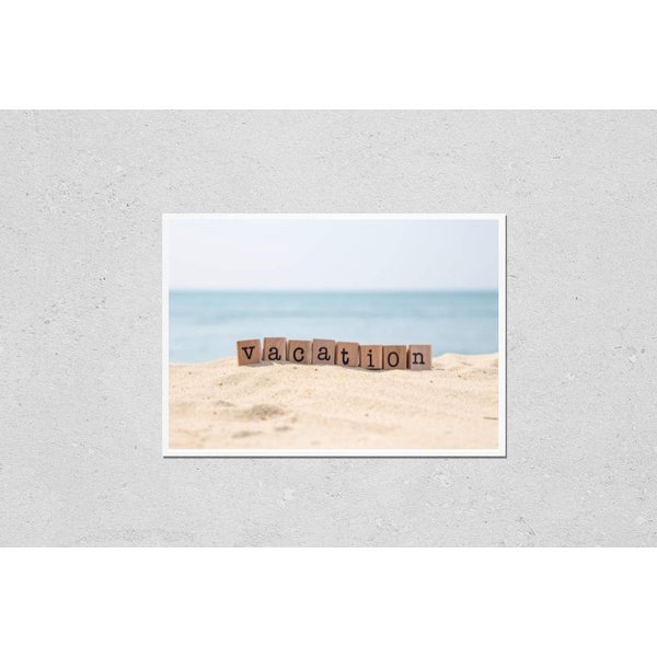 Poster Reproduction of Vacation word on wood rubber stamps stack on the sand beach for holiday and summer season concepts, beautiful blue ocean view during daytime on a sunny day on background